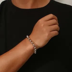 Minimalist stainless steel Rolo chain bracelet with OT toggle clasp shown on wrist