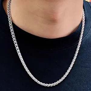 Close-up of a 5mm silver wheat chain necklace on a neck for a masculine hip-hop style look