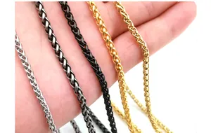 Detailed macro view of 3mm stainless steel wheat chains in silver, gold and black finishes