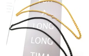 Detail of gold and black 3mm wheat chain necklaces with secure lobster clasps