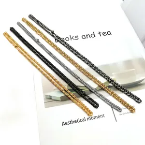 Multiple colors of 3mm stainless steel wheat link chains on a magazine background