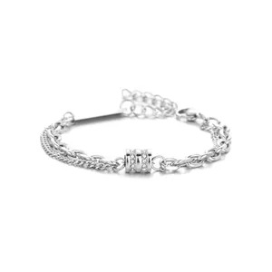 Detail of silver double-layer bracelet with crystal-studded bead and chunky chain links