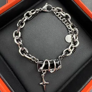 Bracelet chaîne hip-hop avec pierre noire enlacée d'un serpent et pendentif étoile