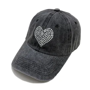 Washed black denim baseball cap for women with sparkling rhinestone heart on the front