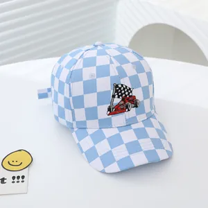 Detailed close-up of sky blue checkered kids baseball cap with racing flag embroidery