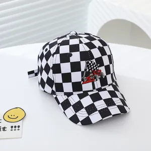 Close-up of racing embroidery and black and white checkerboard pattern on kids baseball cap