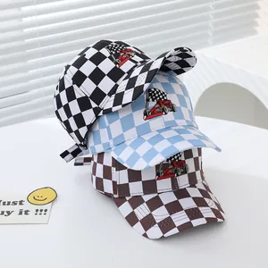 Kids racing baseball caps with checkered patterns in black, blue and brown color options