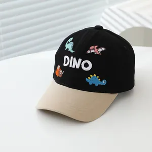 Detail of colorful dinosaur embroidery and DINO text on kids cotton baseball cap