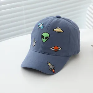 Navy blue kids baseball cap featuring space exploration themed embroidery on white background