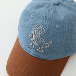 Kids dinosaur embroidery denim baseball cap with blue and brown patchwork design