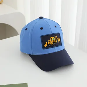 Detailed close-up of kids baseball cap with excavator embroidery and contrast brim