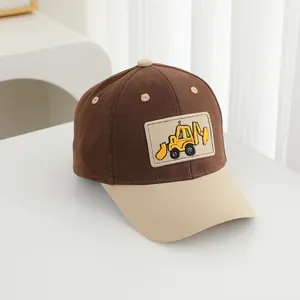 Detail of kids baseball cap featuring excavator embroidery and two-tone cotton twill fabric
