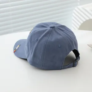 Grey-blue cotton baseball cap with colorful rocket embroidery and metal back buckle