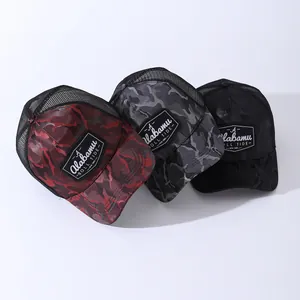 Three camouflage baseball caps with Alabama Roll Tide embroidery and breathable mesh back