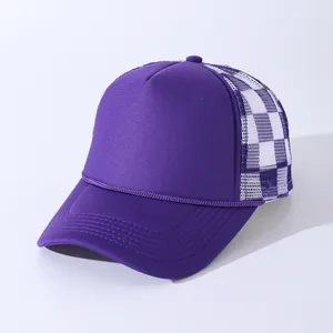 Detail of purple trucker hat showing checkered mesh back and braided rope on the brim