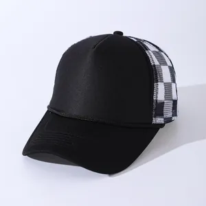 Side view of a black trucker hat featuring breathable black and white checkered mesh