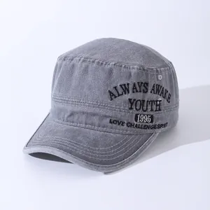 Detail of washed grey military flat top cap with vintage youth embroidery and stitching