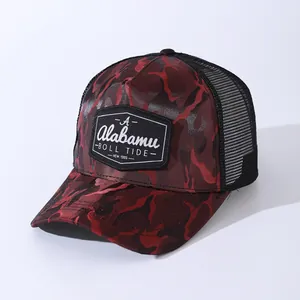 Detailed macro view of the camo mesh trucker cap with red and black camouflage pattern