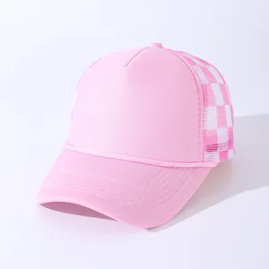 Close-up of pink trucker hat featuring breathable checkerboard mesh and decorative rope detail
