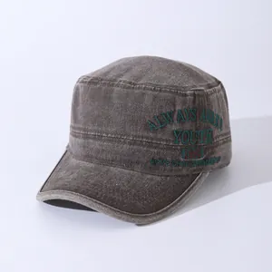 Close-up of vintage washed cotton army cap with dark green Youth 1995 embroidery