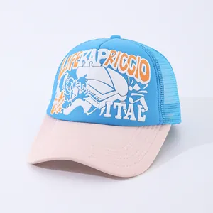 Detail of blue and pink trucker hat featuring retro street art and breathable mesh