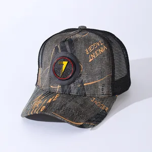 Detailed macro view of the breathable black mesh and distressed grey fabric on a trucker hat
