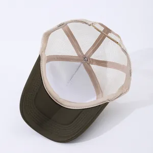 Detail view of trucker hat interior with mesh back and adjustable snapback closure