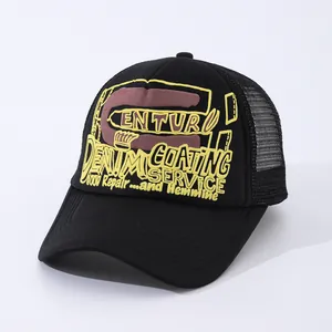 Black trucker hat with yellow 3D foam print lettering and breathable mesh back