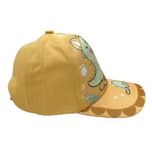 Mustard yellow kids baseball cap featuring a cute green dinosaur on a skateboard