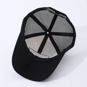 Detail of black trucker hat interior showing breathable mesh and adjustable snapback strap