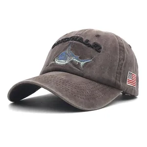 Detail of shark embroidery and American flag patch on washed cotton baseball cap
