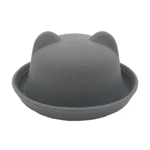 Detail of round grey felt bowler hat with cute cat ears and rolled brim for kids