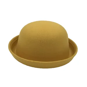 Classic mustard yellow wool felt bowler hat with a vintage rounded dome and curled brim