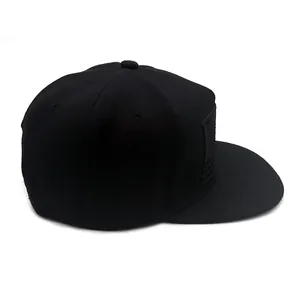 Black snapback baseball cap with embroidered USA flag patch and flat brim design