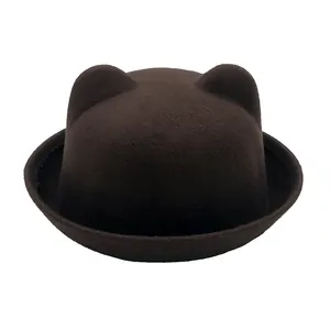 Detailed close-up of dark brown wool felt hat with cute cat ear design and rolled brim