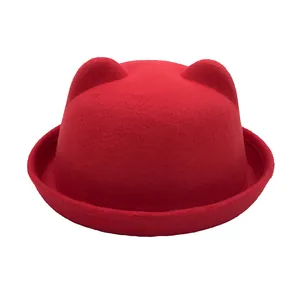 Detailed texture of red wool felt bowler hat with cute 3D cat ear decorations