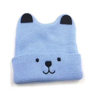 Light blue knit baby hat with bear embroidery and cute cartoon ears for winter warmth