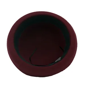 Deep red wool felt bowler hat for kids featuring adjustable inner sweatband and soft brim