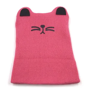 Detailed macro view of the soft knit fabric and cute cat ear design on the pink winter hat