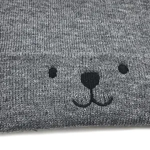 Grey knit baby hat with cartoon bear embroidery and folded rim for winter warmth