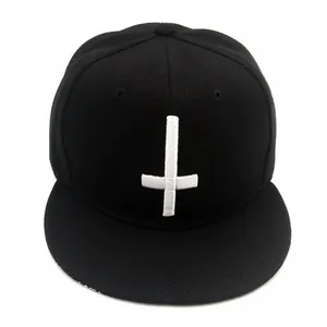Black snapback baseball cap with white 3D embroidered cross and flat brim design