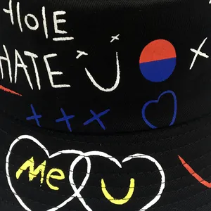 Street style black graffiti bucket hat featuring colorful hand-drawn heart and letter prints