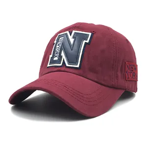 Deep red New York baseball cap with N letter embroidery and curved sun visor