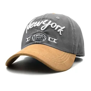 Detail of vintage New York 1962 embroidery on a two-tone cotton and suede baseball cap