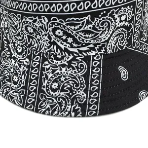 Reversible bucket hat with paisley pattern and monochrome black and white contrast design