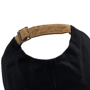 Adjustable black cotton baseball cap with premium brown suede strap and metal buckle