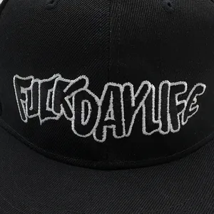 Close-up of street graffiti embroidery on black twill hip-hop baseball cap