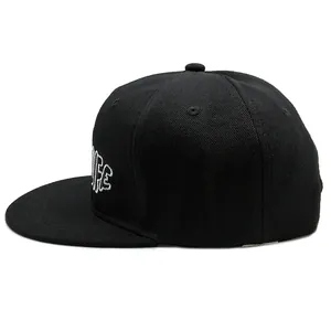 Black snapback hat with white letter embroidery shown from a 45-degree angle view