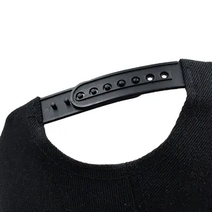 Rear view of black hip hop baseball cap showing adjustable plastic snapback strap details