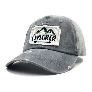 Detailed view of the distressed washed cotton grey baseball cap with Explorer mountain patch